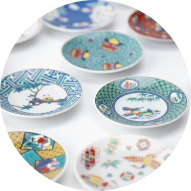 Set of japanese colorful ceramic plates with various patterns on a white background