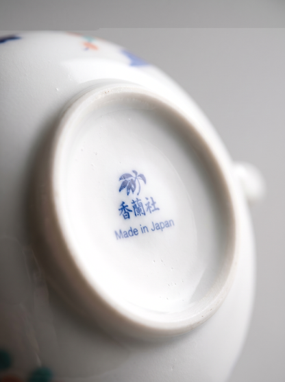 Close-up of a ceramic bowl with 'Made in Japan' text on a white background