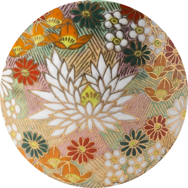 close up of japanese ceramic teacup with golden floral design showcasing the glaze quality