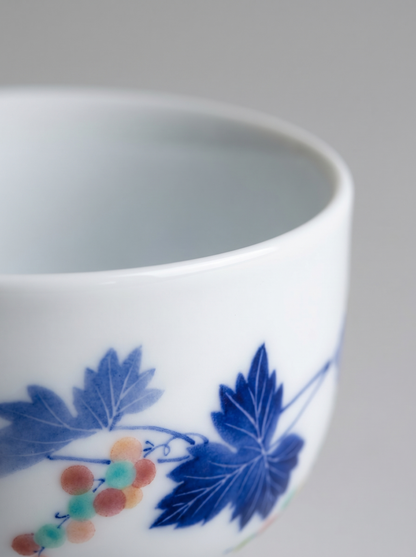 Ceramic cup with blue floral design on a gray background