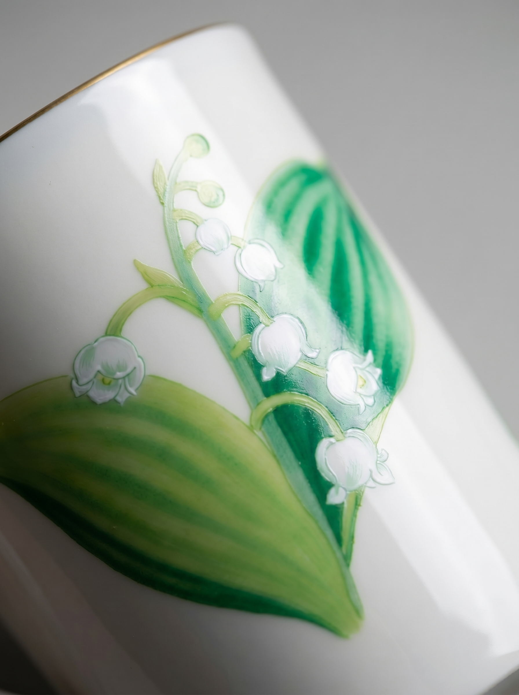 close up of Japanese koransha porcelain teacup with lily of the valley design 