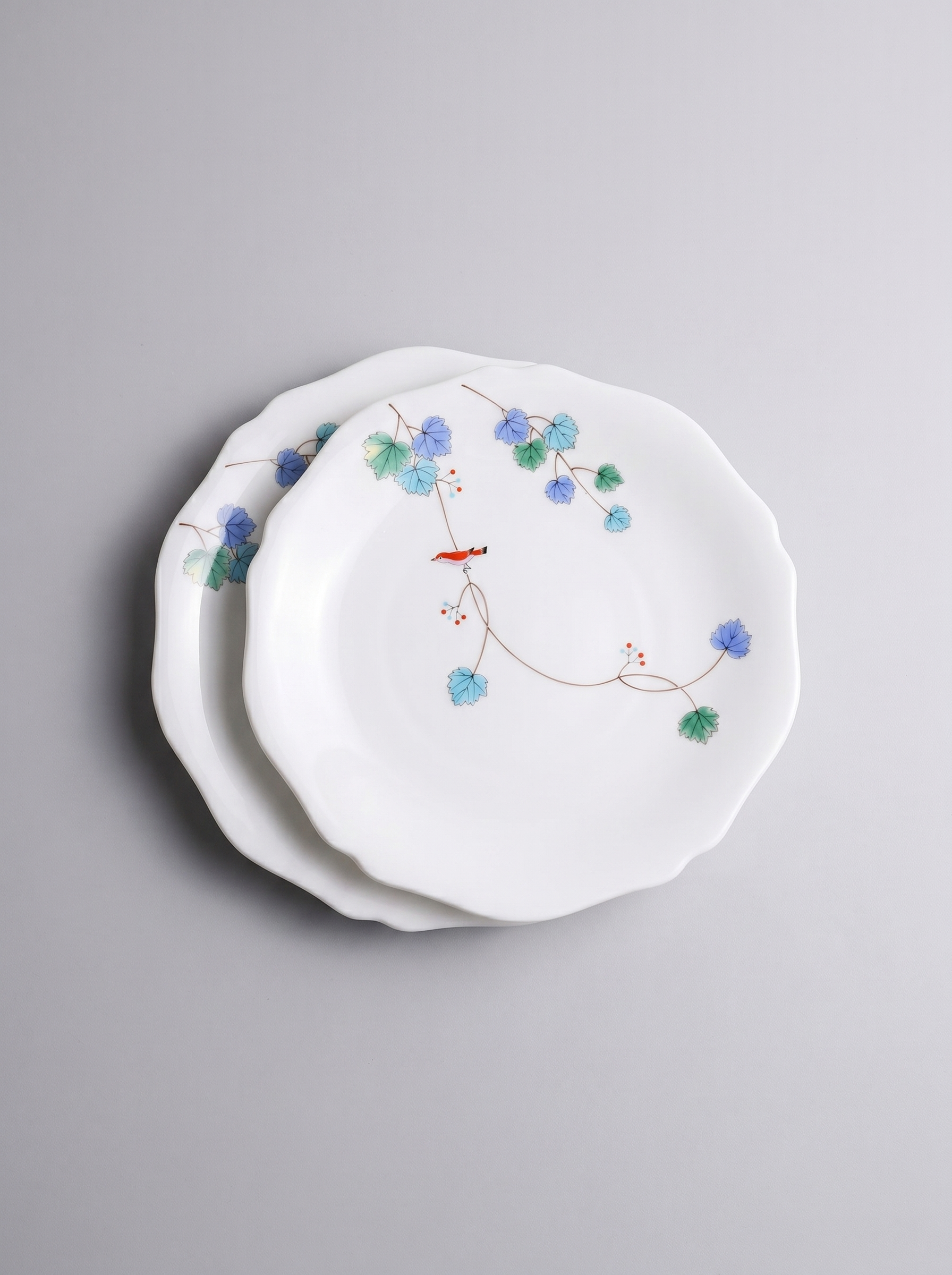 Set of 2 Japanese koransha porcelain dinner plate with floral design on a gray background