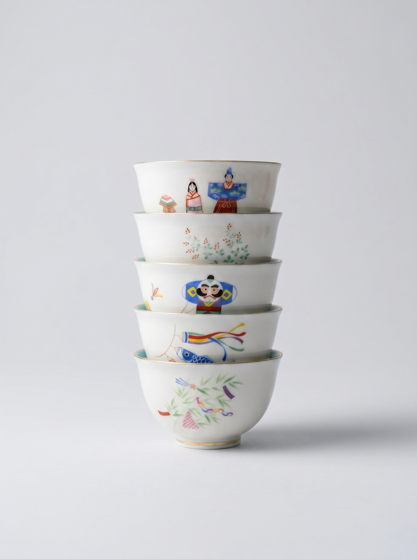 Set of Japanese koransha porcelain small teacups with no handle with colorful and joyful 'holidays' hand-painted designs on a light gray background