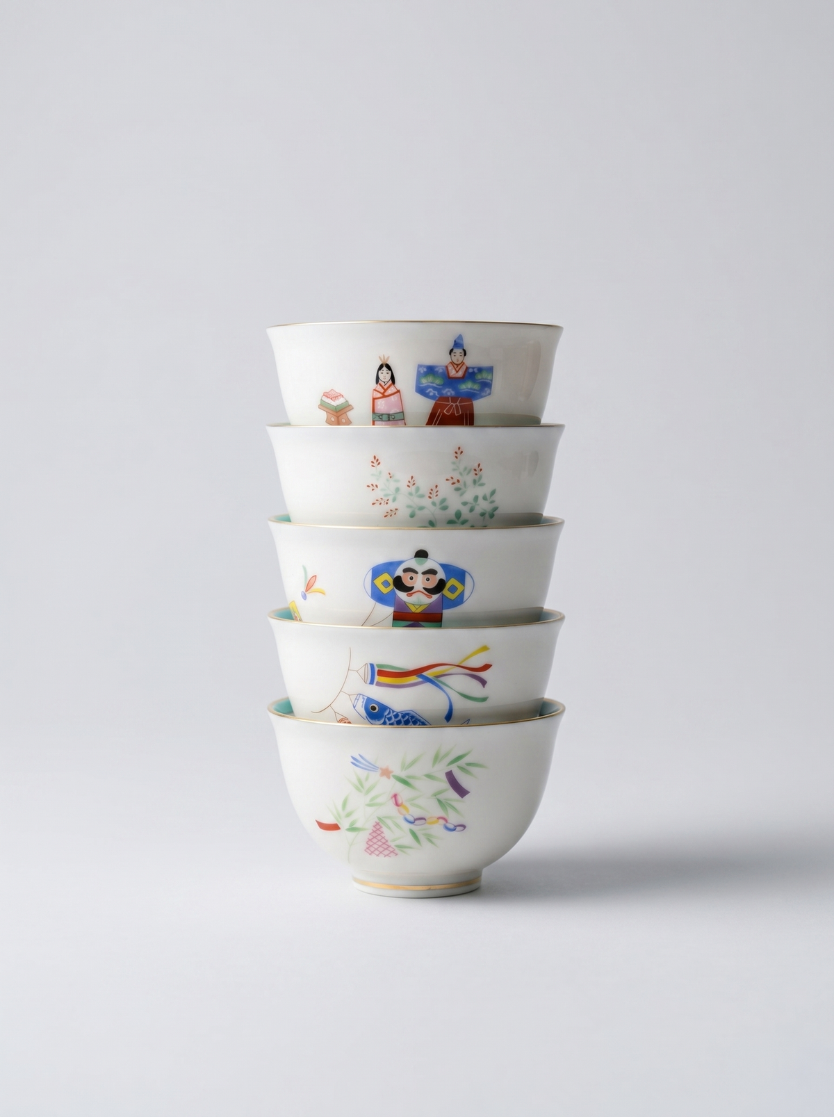 Set of Japanese koransha porcelain small teacups with no handle with colorful and joyful 'holidays' hand-painted designs on a light gray background