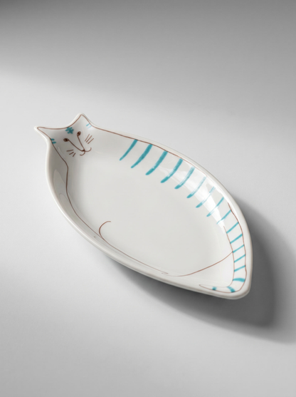 Cat-shaped ceramic plate with blue stripes on a gray background